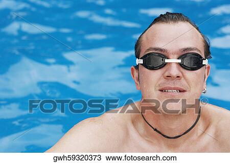 High angle view of a mid adult man in a swimming pool View Large Photo Image Stock Image - High angle view of a mid adult man in a swimming pool. Fotosearch