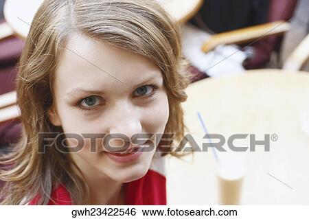High angle view of a teenage girl smiling View Large Photo Image Stock Photograph - High angle view of a teenage girl smiling. Fotosearch