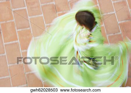 High angle view of a woman dancing View Large Photo Image Stock Image - High angle view of a woman dancing. Fotosearch