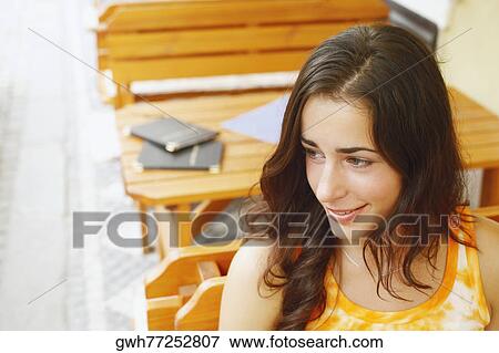 High angle view of a young woman smiling View Large Photo Image Stock Photo - High angle view of a young woman smiling. Fotosearch