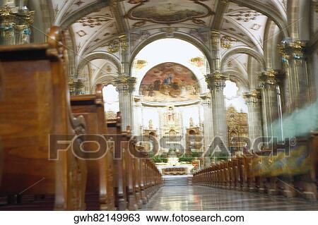Stock Image - Interiors of an ornate church, Mexico City, Mexico. Fotosearch