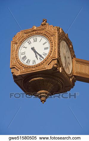 Low angle view of a clock View Large Photo Image Stock Photography - Low angle view of a clock. Fotosearch