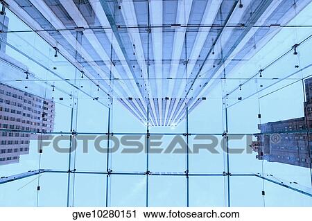 Stock Image - Low angle view of a glass ceiling. Fotosearch