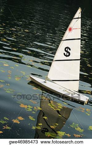 Low angle view of a sailboat in the river View Large Photo Image Stock Image - Low angle view of a sailboat in the river. Fotosearch