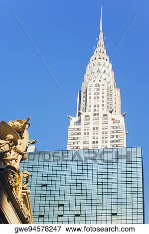 Low angle view of a sculpture in font of a skyscraper, Empire State Building, New York City, New York State, USA View Large Photo Image Stock Photo - Low angle view of a sculpture in font of a skyscraper, Empire State Building, New York City, New York State, USA. Fotosearch