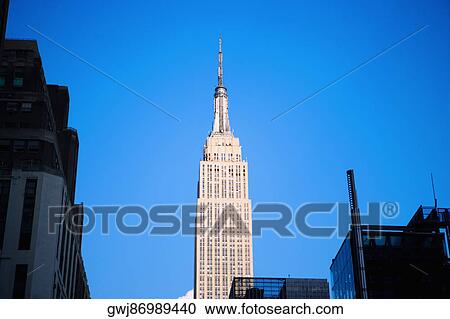 Low angle view of a skyscraper, Empire State Building, Manhattan, New York City, New York State, USA View Large Photo Image Stock Image - Low angle view of a skyscraper, Empire State Building, Manhattan, New York City, New York State, USA. Fotosearch