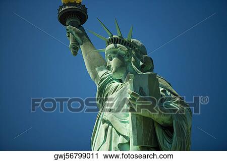 Stock Image - Low angle view of a statue, Statue Of Liberty, Liberty Island, New York City, New York State, USA. Fotosearch