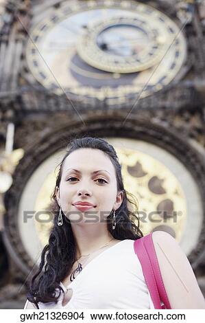 Low angle view of a young woman smiling View Large Photo Image Picture - Low angle view of a young woman smiling . Fotosearch