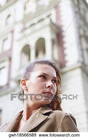 Stock Photo - Low angle view of a young woman. Fotosearch