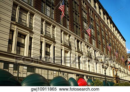 Low angle view of American flags on a building, Manhattan, New York City, New York State, USA View Large Photo Image Stock Photography - Low angle view of American flags on a building, Manhattan, New York City, New York State, USA. Fotosearch