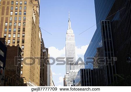 Stock Photo - Low angle view of buildings in a city, Empire State Building, Manhattan, New York City, New York State, USA. Fotosearch