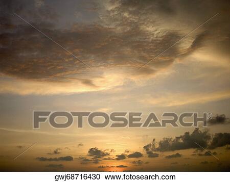 Stock Image - Low angle view of clouds in the sky. Fotosearch