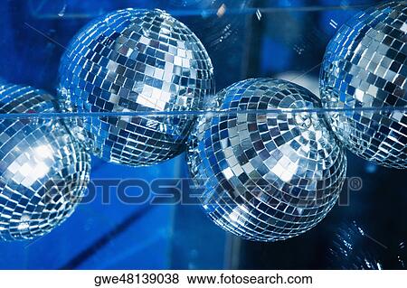 Stock Photo - Low angle view of disco balls. Fotosearch