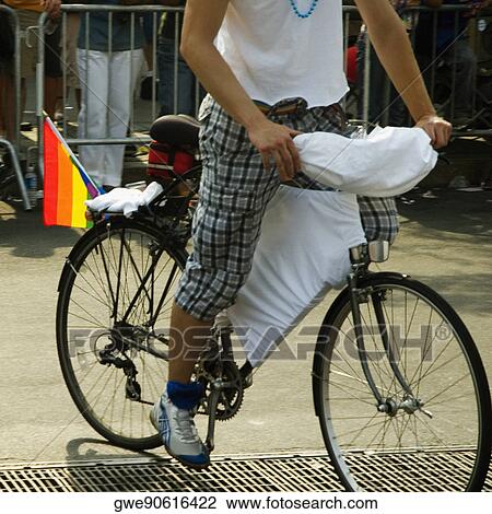 Stock Image - Low section view of a man riding a bicycle. Fotosearch