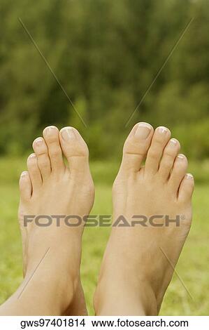 Picture - Low section view of a person's feet. Fotosearch