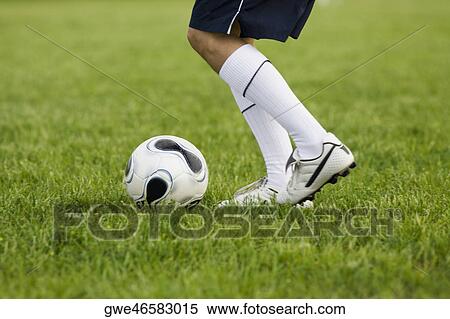 Low section view of a soccer player with a soccer ball View Large Photo Image Stock Photography - Low section view of a soccer player with a soccer ball. Fotosearch