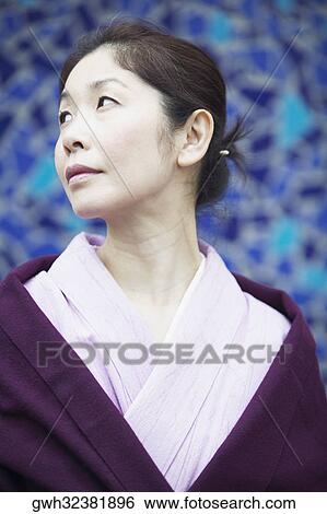 Mature woman looking away View Large Photo Image Stock Photograph - Mature woman looking away . Fotosearch