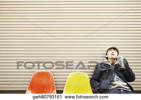 Mid adult man talking on a mobile phone View Large Photo Image Stock Image - Mid adult man talking on a mobile phone . Fotosearch