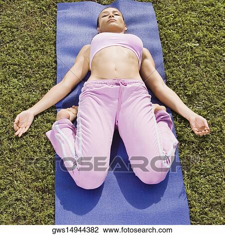 Mid adult woman exercising View Large Photo Image Stock Image - Mid adult woman exercising. Fotosearch