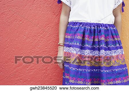 Stock Image - Mid section view of a girl standing. Fotosearch