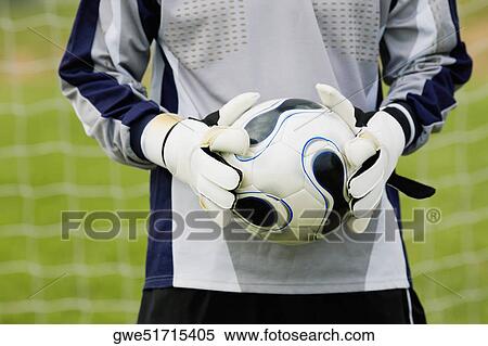 Mid section view of a goalie holding a soccer ball View Large Photo Image Stock Photography - Mid section view of a goalie holding a soccer ball. Fotosearch