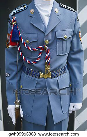Stock Photo - Mid section view of a man in a military uniform. Fotosearch