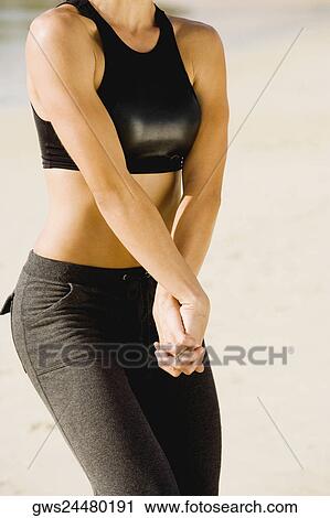 Mid section view of a mid adult woman with her hands clasped View Large Photo Image Stock Image - Mid section view of a mid adult woman with her hands clasped. Fotosearch
