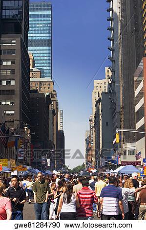 Stock Image - Pedestrian walking on the street. Fotosearch