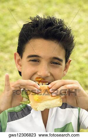 Portrait of a boy eating bread View Large Photo Image Stock Image - Portrait of a boy eating bread. Fotosearch