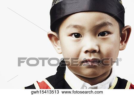 Portrait of a boy looking serious View Large Photo Image Stock Image - Portrait of a boy looking serious. Fotosearch