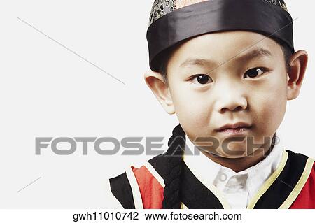 Stock Image - Portrait of a boy posing. Fotosearch