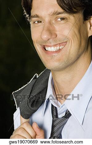Portrait of a businessman smiling View Large Photo Image Stock Photo - Portrait of a businessman smiling. Fotosearch