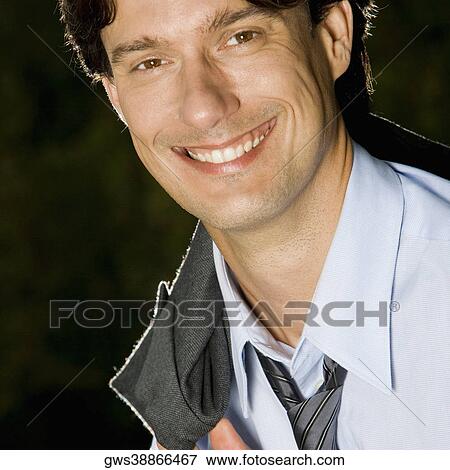 Portrait of a businessman smiling View Large Photo Image Stock Photo - Portrait of a businessman smiling. Fotosearch