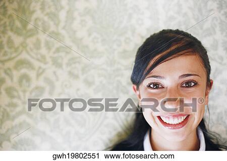 Stock Image - Portrait of a businesswoman smiling. Fotosearch