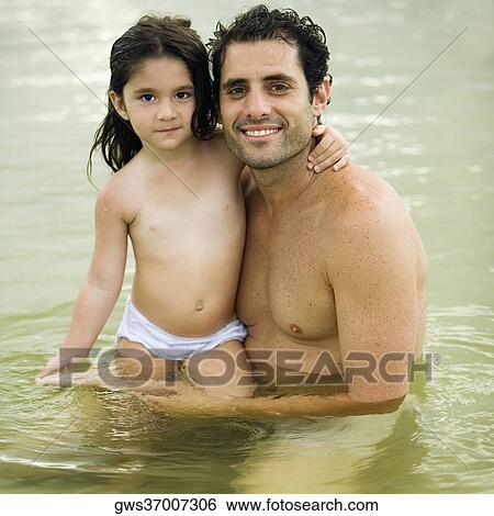 Portrait of a father hugging his daughter View Large Photo Image Stock Photograph - Portrait of a father hugging his daughter. Fotosearch