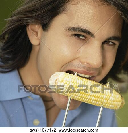 Portrait of a mature man eating corn View Large Photo Image Stock Image - Portrait of a mature man eating corn. Fotosearch