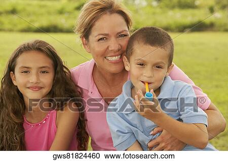 Portrait of a mature woman with her son and daughter View Large Photo Image Stock Image - Portrait of a mature woman with her son and daughter. Fotosearch