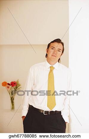 Portrait of a mid adult man leaning against a wall View Large Photo Image Stock Photography - Portrait of a mid adult man leaning against a wall. Fotosearch