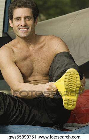 Portrait of a mid adult man putting on boots View Large Photo Image Stock Image - Portrait of a mid adult man putting on boots. Fotosearch