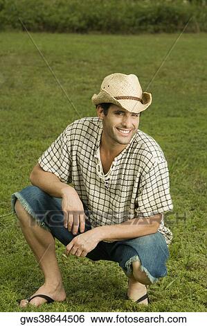 Portrait of a mid adult man smiling in the garden View Large Photo Image Stock Photograph - Portrait of a mid adult man smiling in the garden. Fotosearch