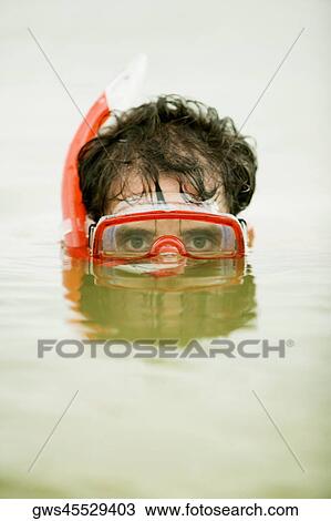 Portrait of a mid adult man wearing a snorkel View Large Photo Image Stock Image - Portrait of a mid adult man wearing a snorkel. Fotosearch