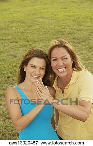 Portrait of a mid adult woman and a mature woman smiling View Large Photo Image Stock Photo - Portrait of a mid adult woman and a mature woman smiling. Fotosearch