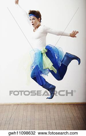 Portrait of a mid adult woman jumping View Large Photo Image Stock Image - Portrait of a mid adult woman jumping. Fotosearch