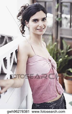 Stock Image - Portrait of a mid adult woman posing. Fotosearch
