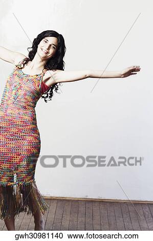 Portrait of a mid adult woman standing with her arms outstretched View Large Photo Image Stock Image - Portrait of a mid adult woman standing with her arms outstretched. Fotosearch