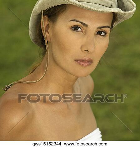 Portrait of a mid adult woman wearing a sun hat View Large Photo Image Picture - Portrait of a mid adult woman wearing a sun hat. Fotosearch