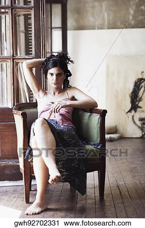Portrait of a mid adult woman with her hand in her hair View Large Photo Image Stock Image - Portrait of a mid adult woman with her hand in her hair. Fotosearch