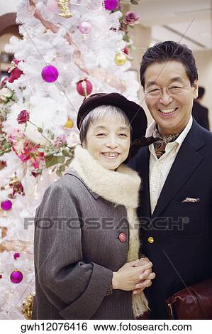 Portrait of a senior man and a mature woman smiling View Large Photo Image Stock Photograph - Portrait of a senior man and a mature woman smiling. Fotosearch