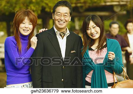 Portrait of a senior man and his two daughters View Large Photo Image Stock Photo - Portrait of a senior man and his two daughters . Fotosearch