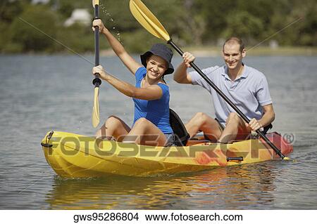 Portrait of a teenage girl and a young man kayaking View Large Photo Image Picture - Portrait of a teenage girl and a young man kayaking. Fotosearch
